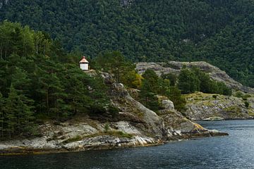 Beacon on rock island by Anja B. Schäfer