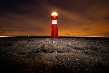 Small classical lighthouse on the Dutch coast by Fotografiecor .nl