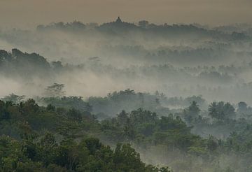 Temple of Borobudur in the morning mist by Karsten Wrobel