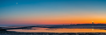 Panorama van een zonsondergang met de Brandaris op Terschelling