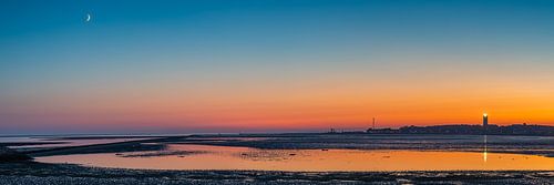 Panorama van een zonsondergang met de Brandaris op Terschelling