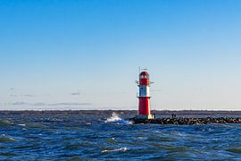 Waves and pier tower on the coast of the Baltic Sea in Warnemünde by Rico Ködder