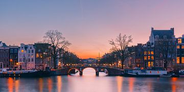 Sunset over the Amstel river in Amsterdam