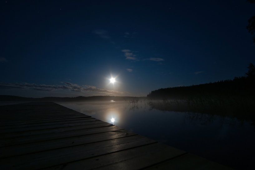 Jetty that reaches into a Swedish lake by Martin Köbsch