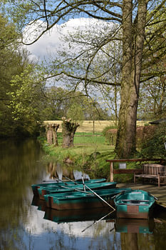 Turquoise rowing boats on a lovely blue spring day.