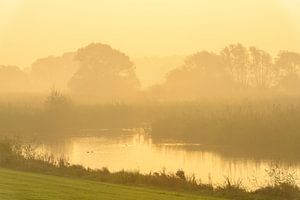 Sunrise over the river IJssel during a beautiful fall morning