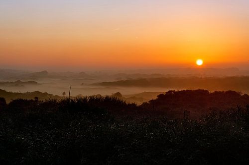 Sunrise over the misty dunes near Oostkapelle