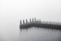 Jetty in the fog at the afsluitdijk
