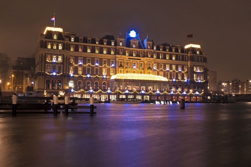 Cityscape of Amsterdam at night along the Amstel by Eye on You