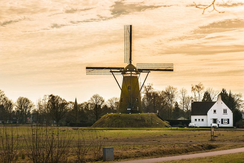 A Dutch Windmill with A yellow sky van Brian Morgan