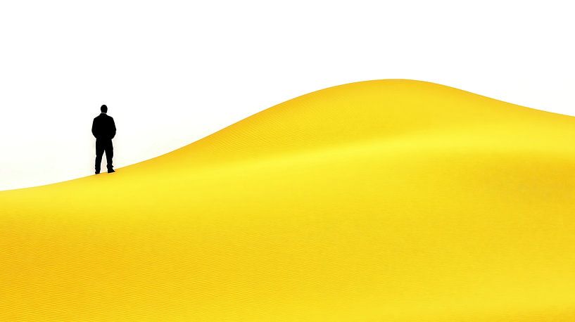 Businessman on a yellow hill by Frank Heinz