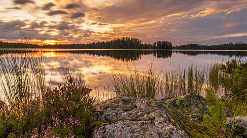 Spectacular red sunset over a lake in Orsa, Sweden