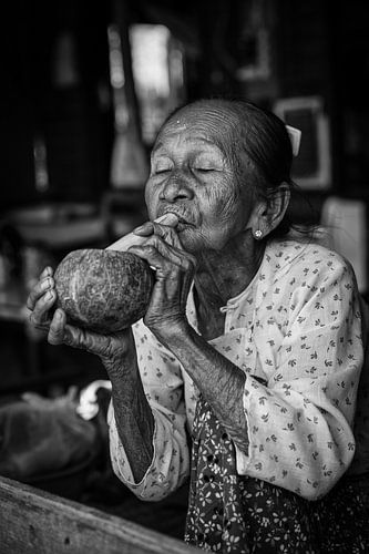 BAGHAN, MYANMAR, 12 DECEMBER 2015 - Cheroot smoking old woman in Baghan. Cheroot is a traditional ci