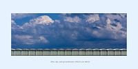 Blue sky and greenhouses whith are white