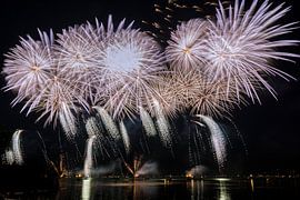 Giant fireworks display with many explosion on night sky