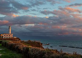 Lighthouse at sunset with clouds by Saskia S