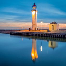 Lighthouse at sunset by Miranda van Hulst