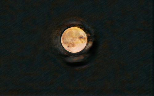 The golden-yellow moon glows like a fiery secret at the centre of the cosmos; surrounded by deep, mysterious hues, the image unfolds like a cosmic eye watching over the night. It radiates a palpable sense of tranquillity and a profound sense of inspiration from this enchanting, picturesque darkness. A virtual space art piece of the moon in Space Arts