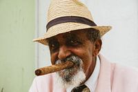 Portrait of a typical old Cuban man with a cigar