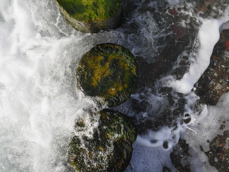 Groynes in the surf from above by Jörg Hausmann