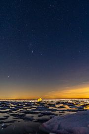Orion above the Wadden Sea with ice floes by Marjolein van Roosmalen