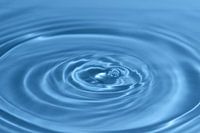 Textuur, achtergrond gemaakt met dompelende waterdruppel