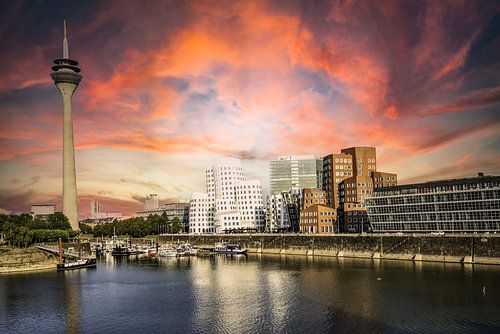 Rhine and media harbour in Düsseldorf with Rhine tower and Gehry buildings with evening glow
