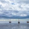 Boats on the tidal flats Ameland by R Smallenbroek