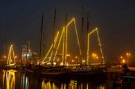 Decorated sailboats at Christmas in Harlingen harbour in the Netherlands at sunset by Eye on You thumbnail