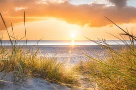 Sunrise on the beach by the Baltic Sea