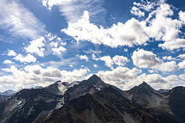 The Gran Paradiso massif in the Italian Alps beneath a cloudy sky. by André Blom Fotografie Utrecht