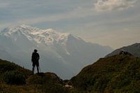 Hiker looks out over Mont Blanc mountains