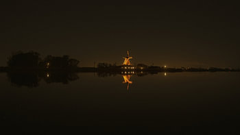 Night shot of windmill Leonide at the waterfront in Anna Paulowna