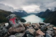 Stacked stones at a lookout point by Martijn Smeets thumbnail