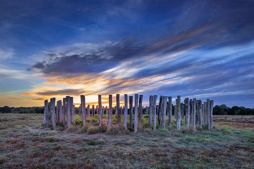 Early bronze age tomb on a moorland with a colorful sunset  by Tony Vingerhoets