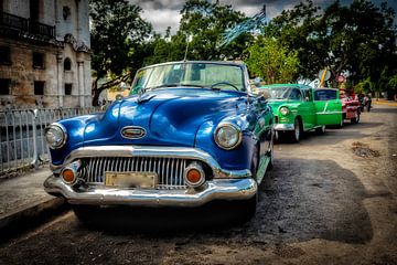 Oldtimer vintage cars convertible in street of the old town of Havana Cuba by Dieter Walther