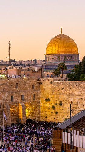 People at the Wailing Wall in Jerusalem (with Dome of the Rock in the background)