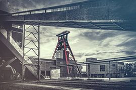 The double trestle of shaft 12 - winding tower at Zollverein colliery under a dramatic sky - "E