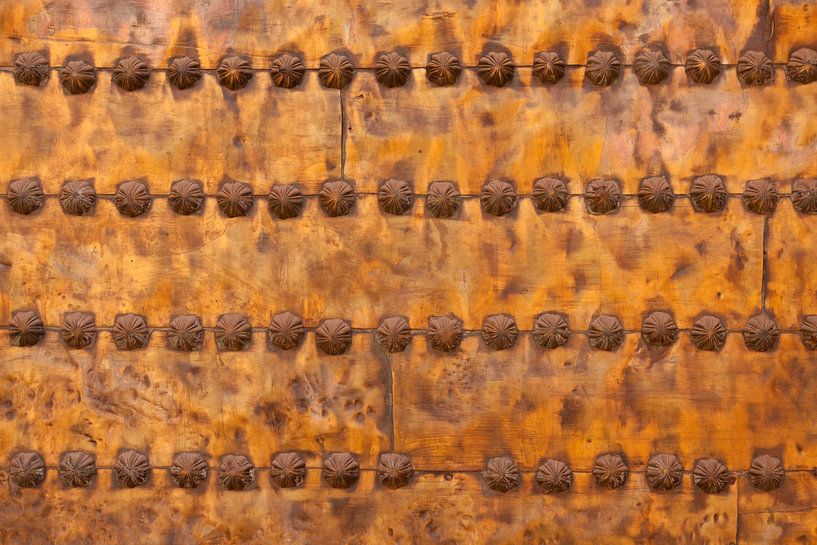 Beautiful textures on a copper door of a Riad in Marrakech, Morocco. With beautifully applied decora by Bas Meelker