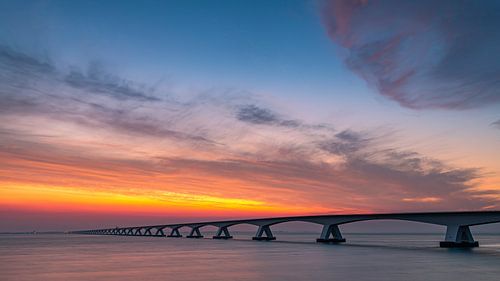 Zonsopkomst bij de Zeelandbrug, Zeeland, Nederland