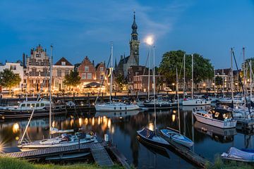 The evening has fallen in picturesque Veere, the moon rises by Jeroen de Jongh