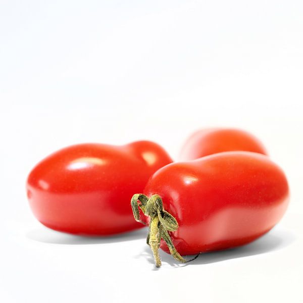 ripe Roma tomatoes by Heiko Kueverling