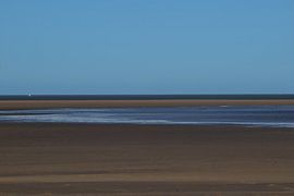 Landscape with a dutch sandy beach on the coast of Zeeland by Robin Verhoef