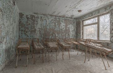 cots in an abandoned children's hospital Pripjat by John Noppen