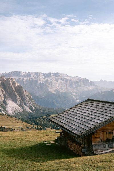 A typical wooden mountain barn in a crazy landscape surrounded by mountains by Marit Hilarius