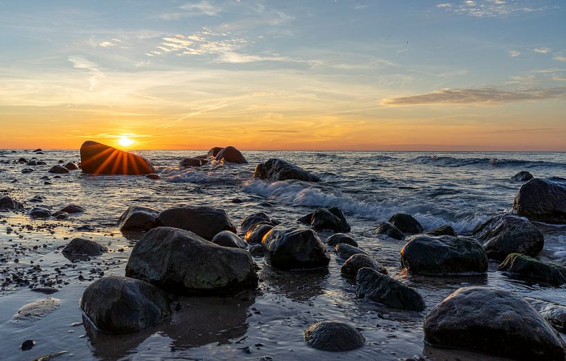 Sunset on the beach with rocks on the Rügen Baltic Sea in Germany by Animaflora PicsStock