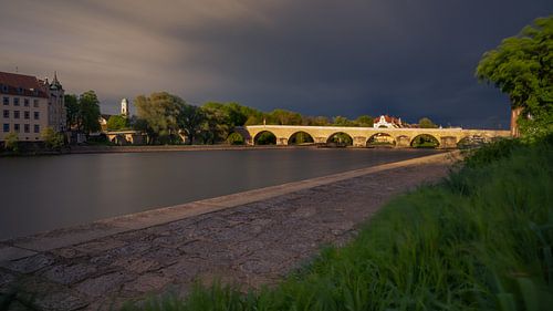 Stone Bridge over Danube river in Regensburg on stormy