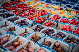 Trays filled with fruit and vegetables at a French market
