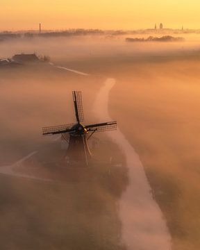 Misty Morning at the Mill - Golden Light over Polder Landscape by Ewold Kooistra