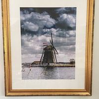 Klantfoto: Eendrachtsmolen langs de Rotte met de Nederlandse vlag van Ricardo Bouman, als fotoprint